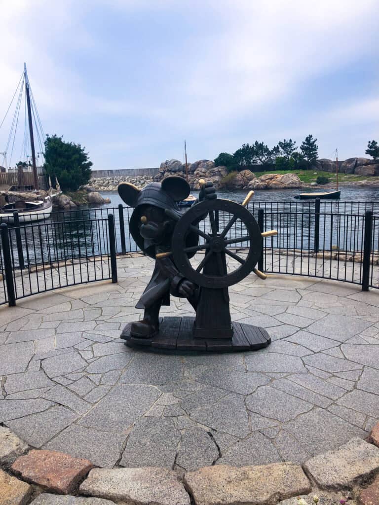 Statue of Mickey Mouse at a steering wheel