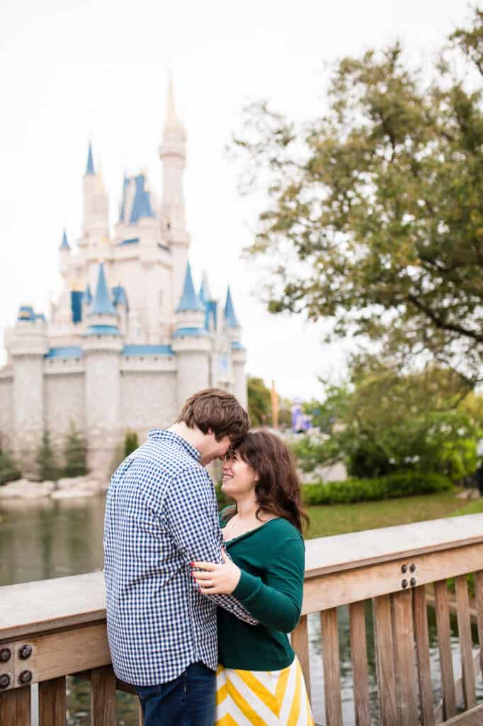 Boy and girl hugging in front of DisneyWorld castle