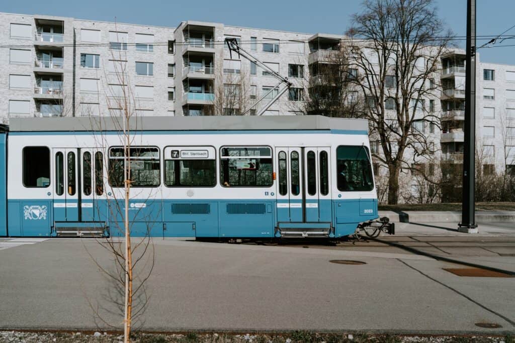 Blue and white bus on street in Zurch